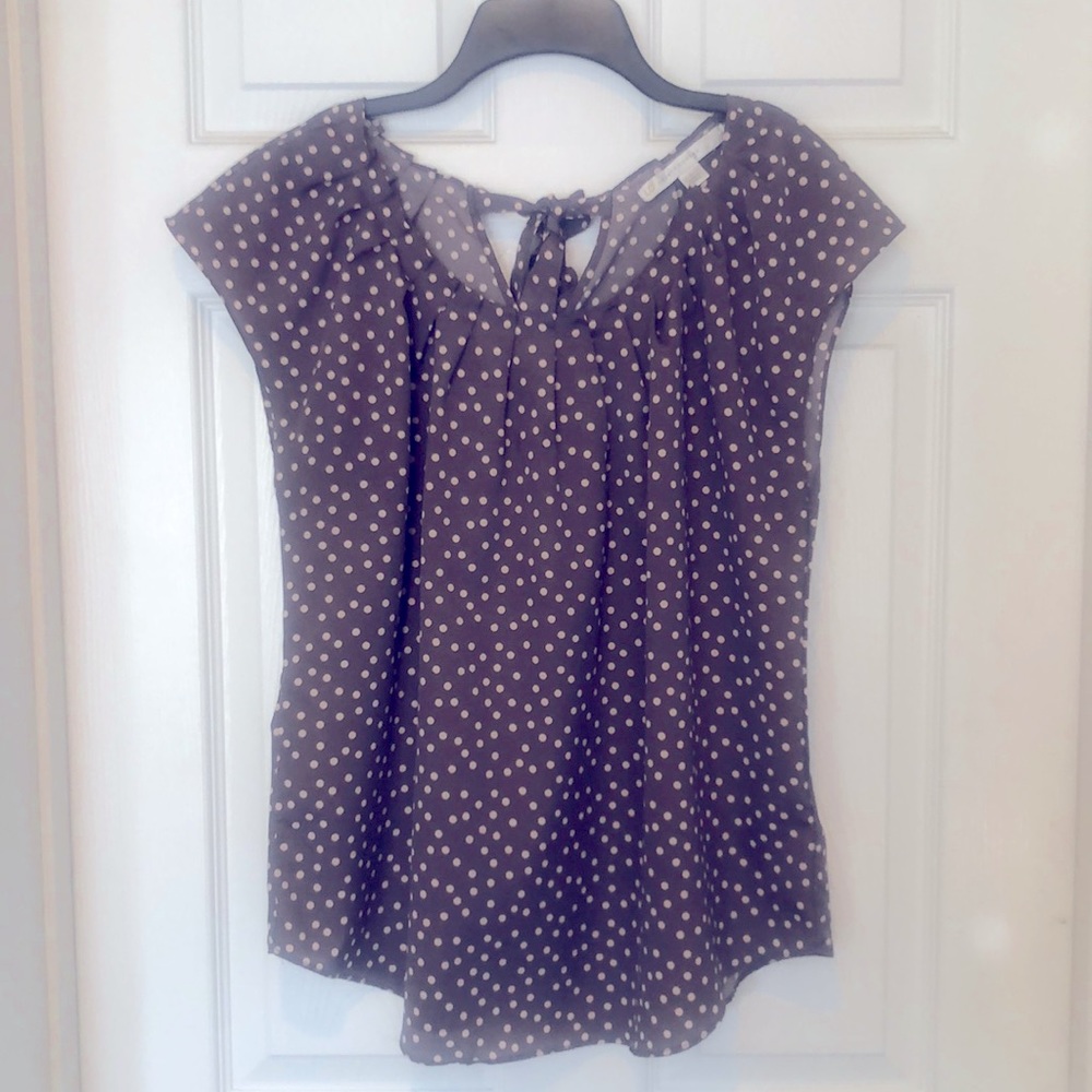 The neckline on the shirt is gorgeous the back bow is stunning very versatile !